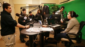 Brian Foster, a junior at Excel High School, speaks on air in the Herald Radio studio with Joe Battenfeld and Erica Moura during a visit the Boston Herald.